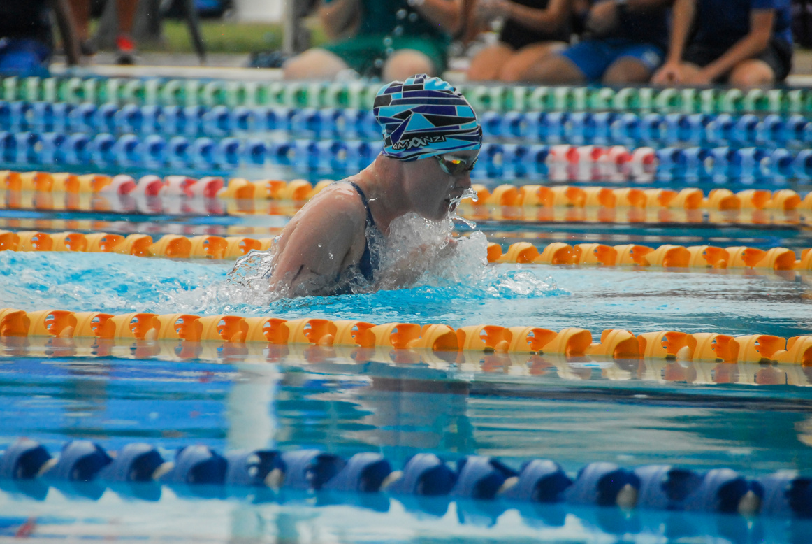 Person Wearing Swimming Goggles on Swimming Pool